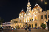 Fototapeta  - Ho Chi Minh City Hall and tourists at night