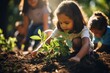 A child plants seedlings in the garden. The child and the surrounding world, development and teaching children to interact with the outside world