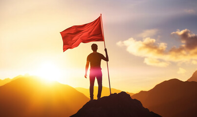 Wall Mural - Silhouette of person on mountain top holding red flag at sunset in success and achievement  concept