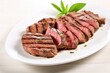 © primopiano - close-up of freshly grilled lamb chops on a white ceramic plate