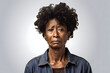 Crying senior African American woman, head and shoulders portrait on light grey background. Neural network generated image. Not based on any actual person or scene.