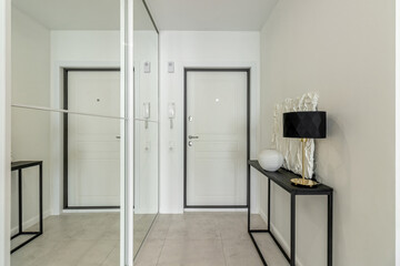 Minimalist hallway with modern interior design in contemporary apartment.