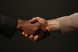 Fototapeta  - Close-up of Diverse hands in suits reach out, symbolising unity and respect in a corporate context, against a neutral background with clean lighting