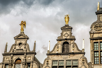 Wall Mural - roofs of ancient buildings with gilded figures antwerpen