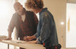 © Jacob Lund - Homeowners discussing renovation project with tape measure and plank