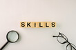 © panadesignteam - Skills Wooden Block Words Concept Background