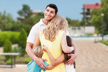 Poster - Happy young family in the city garden