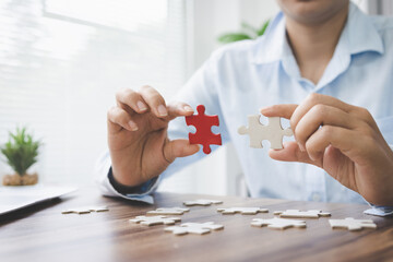  person hand connecting jigsaw puzzle pieces, business solutions, goals, success, goals and strategy concept, teamwork concept.