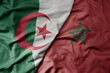 big waving national colorful flag of algeria and national flag of morocco .