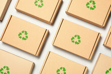 Cardboard Boxes With Recycle Sign Stamps On Light Grey Background, Flat Lay