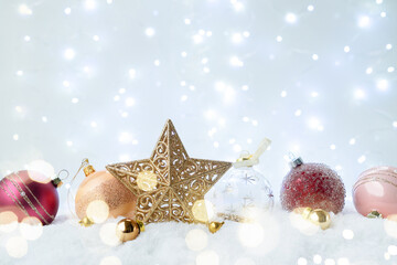 Canvas Print - White christmas with snow - pink and golden decorations with stra over festive bokeh lights