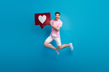 Poster - Full body photo of carefree cheerful young man jumping hands hold like notification collage isolated on blue color background