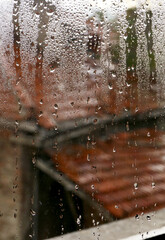 Wall Mural - raindrops on the window of an old house