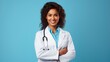 © shooreeq - Smiling happy woman doctor standing on bright color background