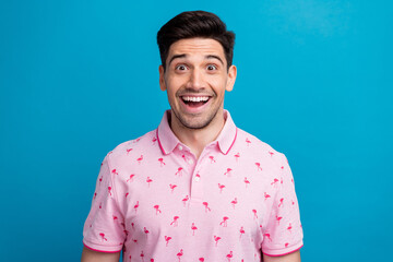 Poster - Photo of positive impressed speechless young man open mouth cant believe isolated on blue color background