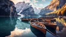 Boats peacefully drifting on the serene waters of Braies Lake, also known as Pragser Wildsee, nestled in the picturesque Dolomites mountains of Sudtirol, Italy