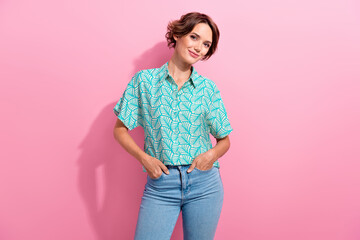 Poster - Photo of satisfied glad young lady put hands pockets posing empty space ad isolated on pink color background