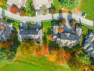 Wall Mural -  aerial view of apartment community beside golf course in autumn