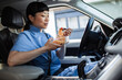 © Davor - Nurse enjoying a meal in her car during a break