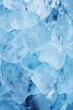 © Fotograf - A close-up view of a bunch of ice cubes. This image can be used to depict cold drinks, summer refreshments, or as a background for beverage-related content.