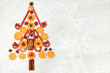 Christmas background in the form of an edible Christmas tree with winter traditional spices to improve immunity during the cold period. Star anise, cinnamon and dried oranges and tangerines 