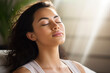 Serene female practicing mindfulness meditation, engaging in self-reflection for mental clarity and emotional balance