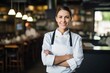 © Adriana - Smiling attractive female chef posing at his place of work