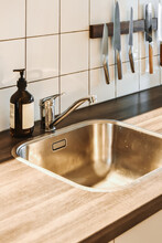 Stainless Steel Sink And Faucet In Kitchen