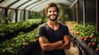 © mg photo - Smiling gardener standing in a greenhouse with strawberries created with Generative AI