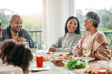 Wall Mural - Smile, food and relax with big family in dining room for lunch, happy and holiday celebration. Thanksgiving, party and dinner with people laughing at table in home for nutrition, happiness and love