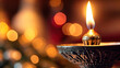 A close-up of a Christmas candle with a flickering flame.