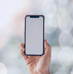 Aufkleber - Person, hands and phone mockup screen for advertising, social media app or networking space on a bokeh background. Closeup of mobile smartphone display for advertisement, logo branding or marketing