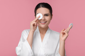 Sticker - Young woman with cotton pads on pink background