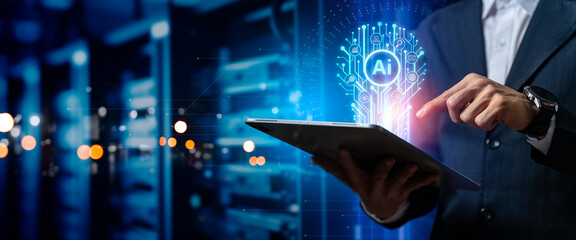 Businessman touching the idea working of Artificial Intelligence (AI) in the futuristic business and coding software development on edge computer,synchronize network connection,IOT,innovative.