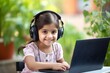 A young Indian girl is attending online school or classes. Learning at home concept in India. outside