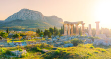 Ruins Of Temple Of Apollo At Sunset, Ancient Corinth In Greece