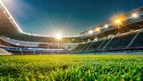 Fototapeta Sport - Lawn in the soccer stadium. Football stadium with lights. Grass close up in sports arena - background