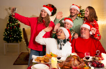 A happy family holds a Christmas party at home on the holiday.