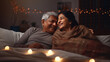 Elderly Indian Couple laying on bed at home