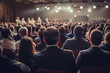 © Jasmina - Rear view of people in audience at the conference hall listening to the speaker giving a talk in conference hall at business event