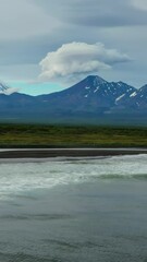 Wall Mural - aerial view of khalaktyrsky beach with black sand and volcano on kamchatka peninsula, russia, pacifi