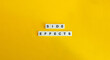 Side Effects Phrase on Letter Tiles on Yellow Background. Minimal Aesthetic.