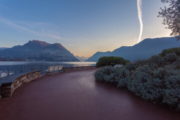 Wall Mural - Panorama of Lugano lake in autumn early morning view from Paradiso district, Lugano, Ticino, Switzerland