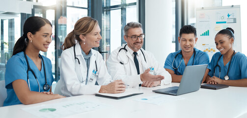 Doctor, team and meeting with laptop in conference for medical discussion or consultation at the hospital. Healthcare professionals on a video call in teamwork communication on computer at the clinic