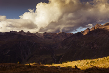 Wall Mural - Sunset panorama with beautiful dramatic sky of the peaks on the border between Italy and Austria. Mountains popular with hikers and climbers. Vallelunga, Alto Adige, Italy