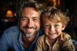 © Soffee - Happy father's day. Parents and children being friends. Portrait of cheerful and joyful father and son smiling together to camera, spending time at home together. Single dad concept