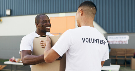 Wall Mural - Volunteer men, helping and boxes for charity, food and clothes drive with community service for kindness. Teamwork, support and social responsibility for donation package, smile and care in workshop