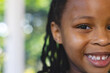 © Wavebreak Media - Portrait of happy african american girl in bright living room at home, copy space