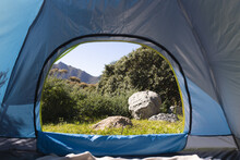 View Of Rock In Sunny Countryside And Distant Mountain From Inside Tent At Campsite, Copy Space