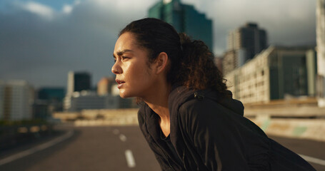 Poster - Woman, runner and breathe in road for fitness, exercise or wellness with city background or nature. Athlete, person and tired or break for workout, training and healthy body with sportswear in town